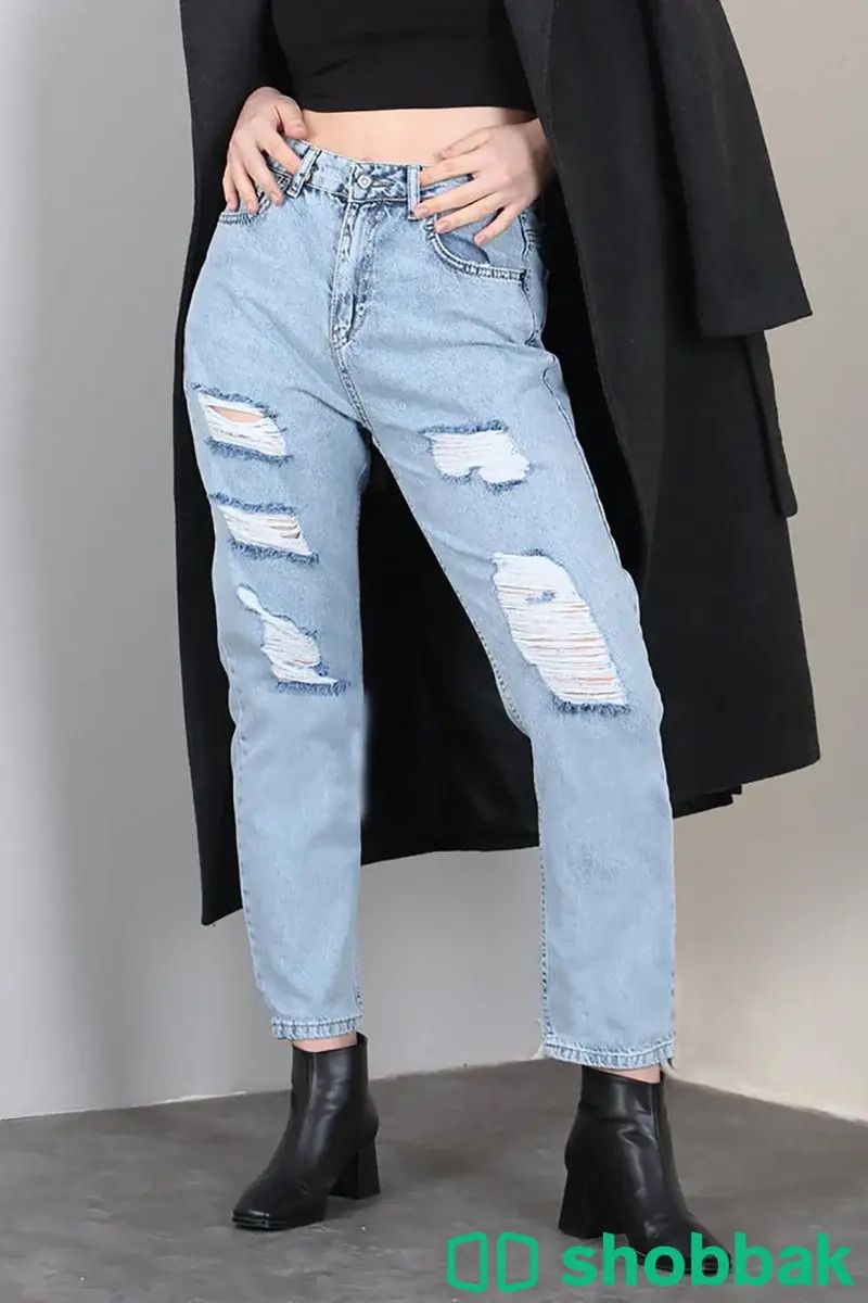 بنطلون جينز نسائي ازرق بتفاصيل ممزقة بتصميم عصري صناعة تركية شباك السعودية