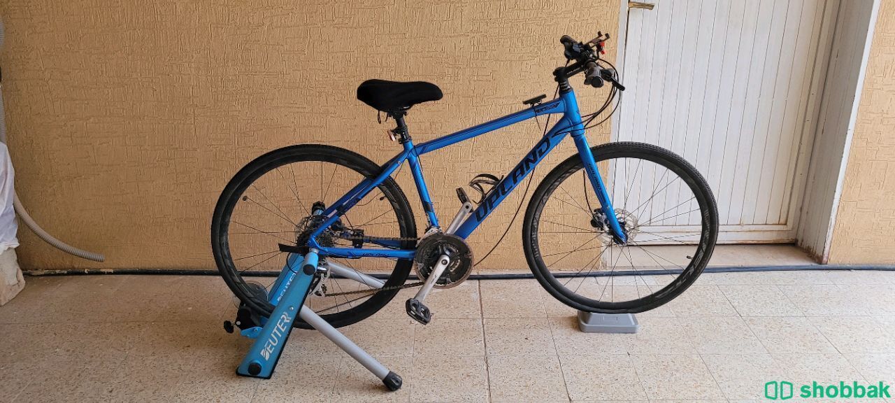 دراجة هجين للبيع مع جهاز  تدريب منزلي. Shobbak Saudi Arabia