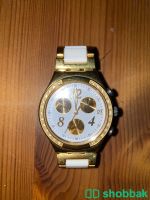 ساعة Swatch ذهبية وأبيض Shobbak Saudi Arabia