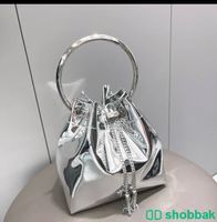 شنطة مستوحاة من ماركة jimmy choo باللون الفضي اللامع Shobbak Saudi Arabia