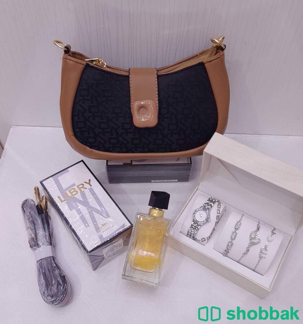 عرض شنطة دكني مع عطر وساعة  Shobbak Saudi Arabia